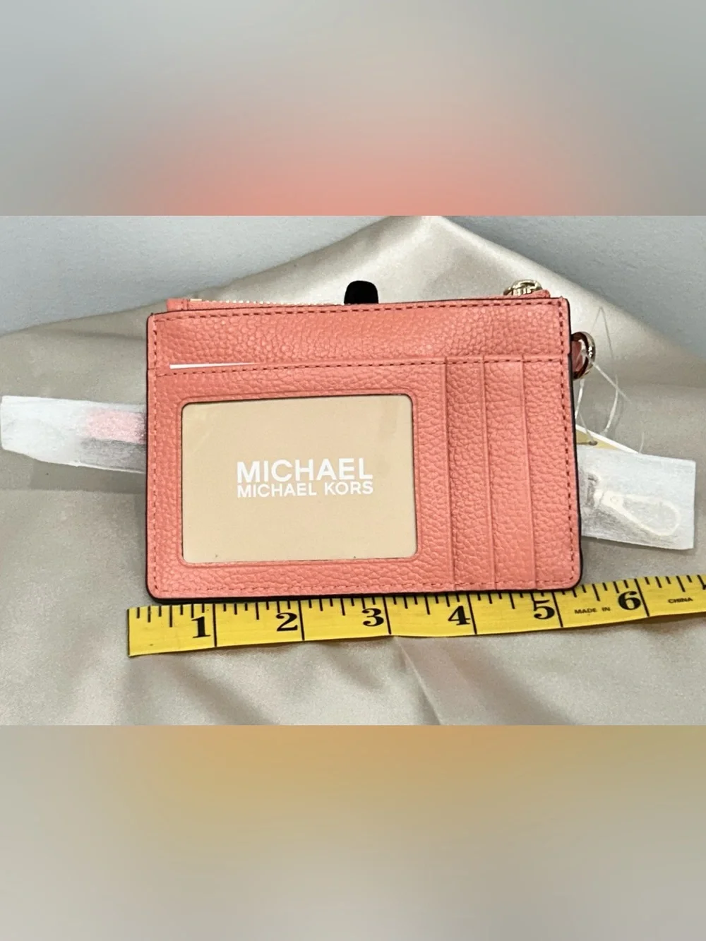 Michael Kors Coral Pink Pebbled Leather Mini Wristlet